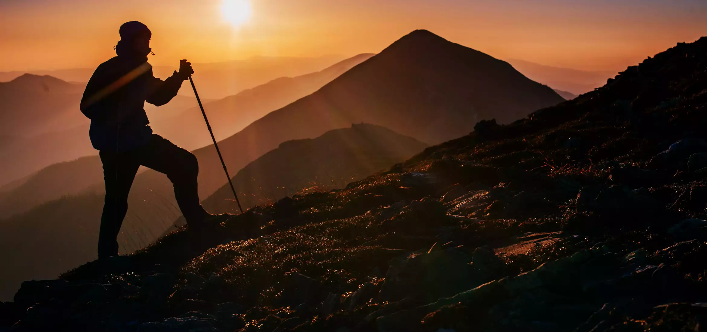 tourist in the mountains at sunset